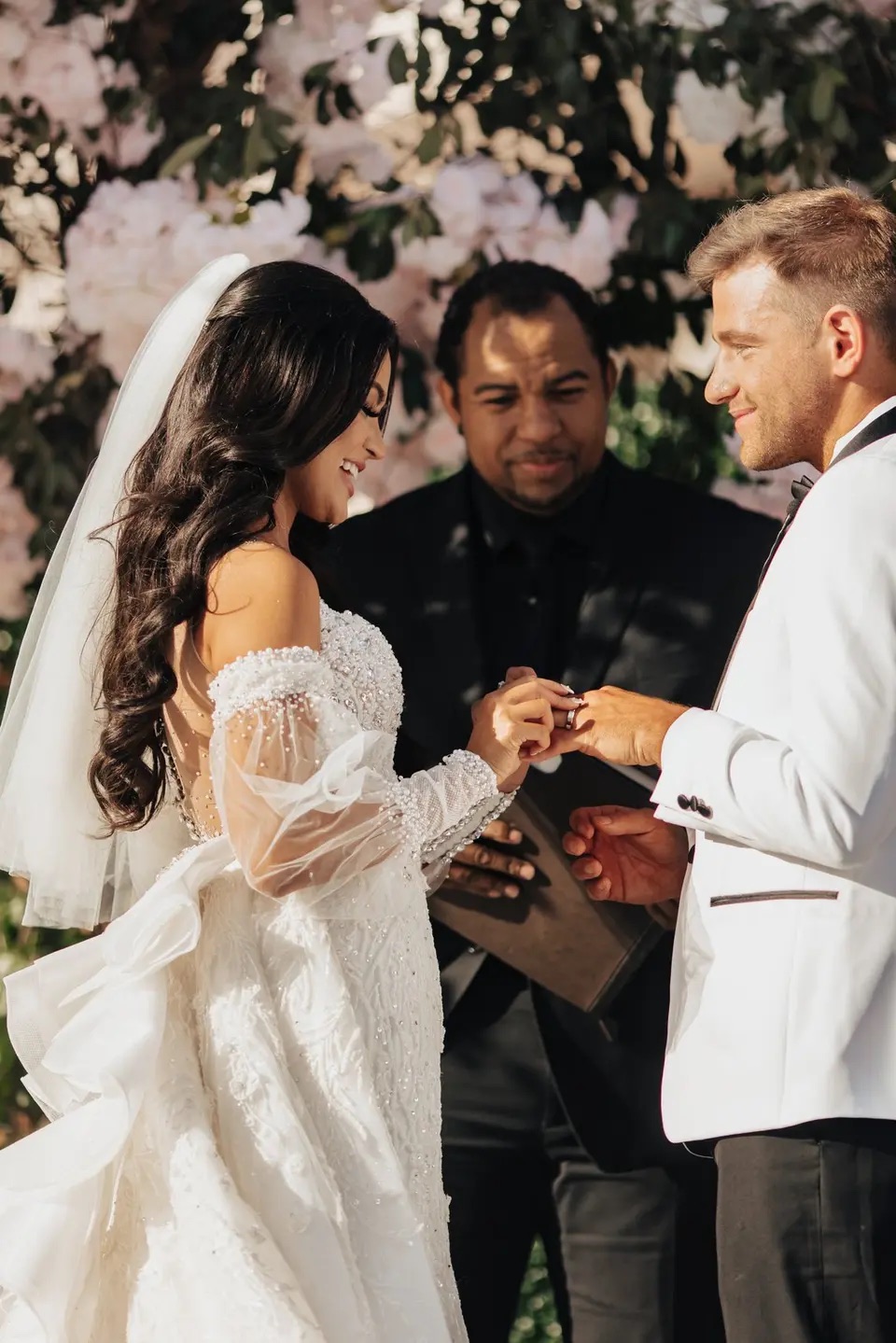 Wayde guiding a couple through their ring exchange