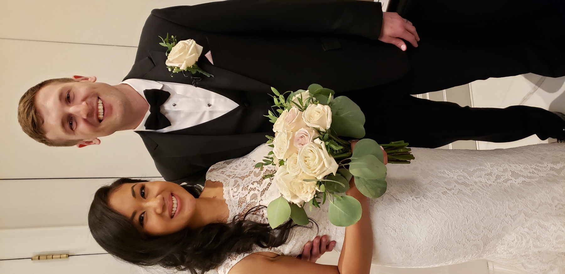 Newly married couple in elegant formal attire