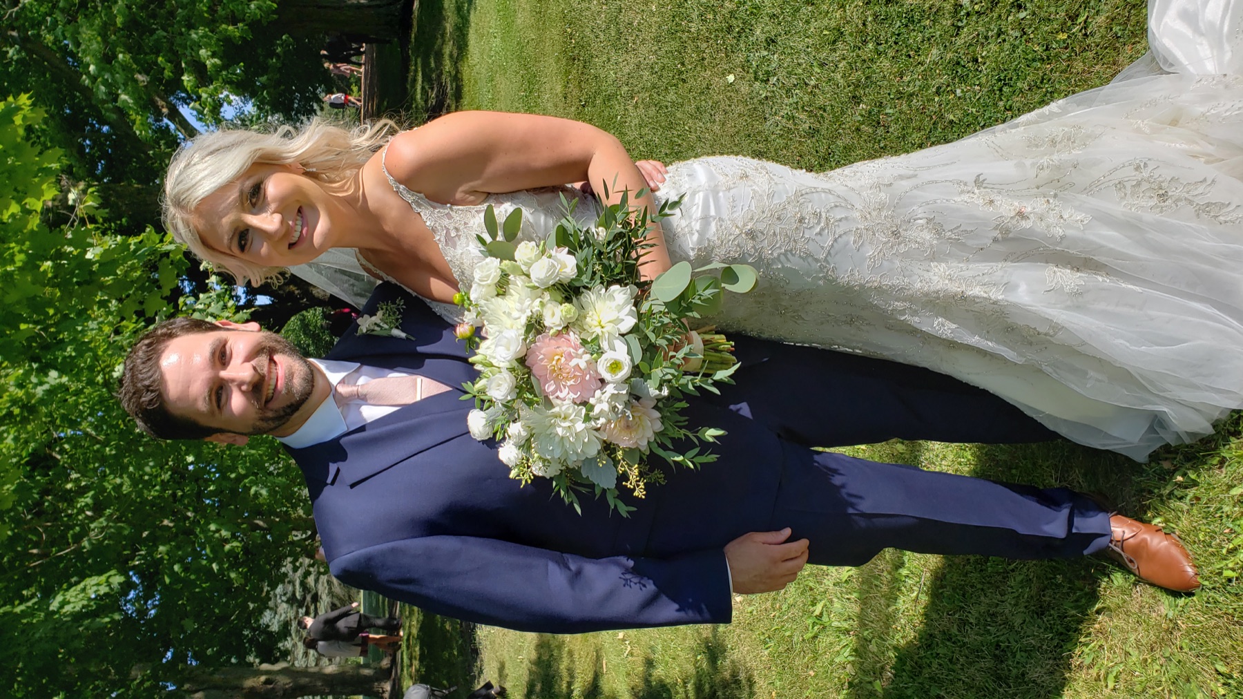 Newlyweds together at an outdoor garden wedding