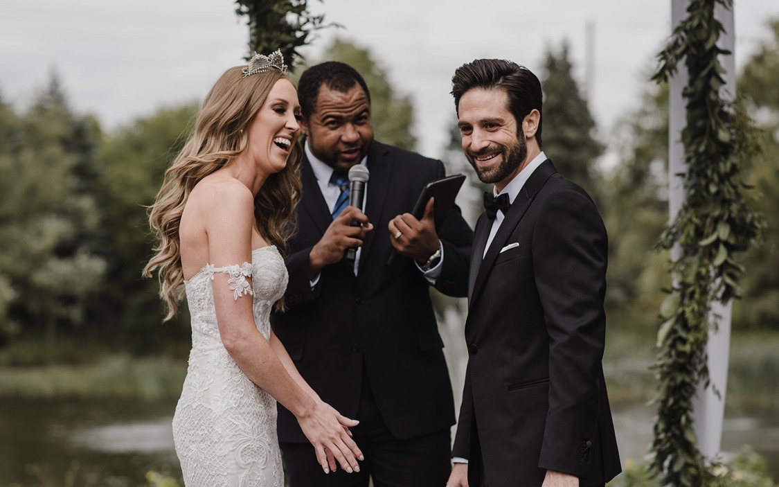 Wayde bringing warmth and laughter to a lakeside ceremony